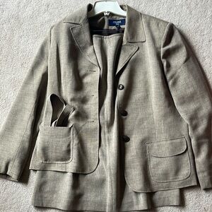 Tan Jones wear skirt suit set